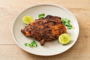 spicy grilled jamaican jerk chicken photo