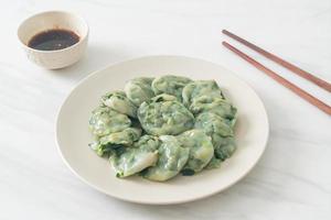 steamed chives dumplings with sauce photo