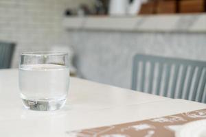 glass of water on table photo