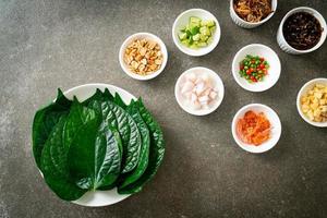 Miang kham - A royal leaf wrap appetizer photo