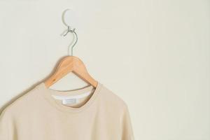 t-shirt hanging with wood hanger photo