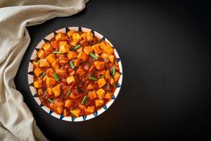 Mapo Tofu - The traditional Sichuan dish of silken tofu and ground beef, packed with mala flavor from chili oil and Sichuan peppercorns. photo