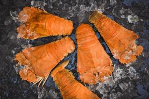Flathead lobster shrimps on ice, fresh slipper lobster flathead boiled for cooking in the seafood restaurant kitchen or seafood market, Rock Lobster Moreton Bay Bug