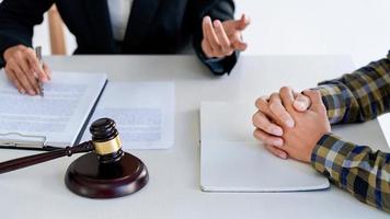 lawyer having meeting and consoling solution to his clients provide legal advice and trust commitment strain serious for problem, justice and attorney concept photo