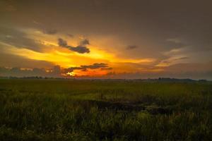 Beautiful landscape with dusk in sunset sky photo