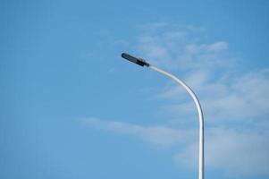 LED street lights lit under the blue sky photo