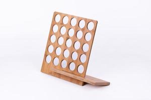 The small item storage rack made of bamboo is on a white background photo