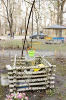 artificial Water Well With Pulley and Bucket photo