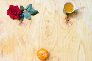 Fresh banana and persimmon in brick wall background and wooden table, photo