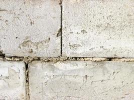 Grey brick wall texture background. Tiled. close- up photo