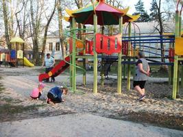 multi-colored slide on the playground day spring photo