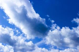 Clouds and blue sky background with copy space photo