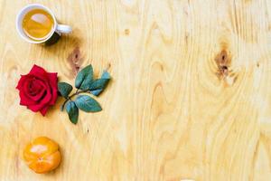 Fresh banana and persimmon in brick wall background and wooden table, photo