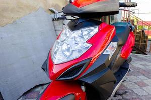 Closeup of red motorcycle. Beautiful modern red motorcycle photo