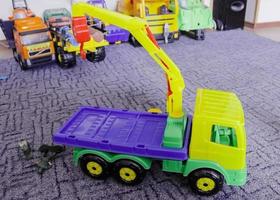 The elevating crane, children's wooden toy. colorful photo
