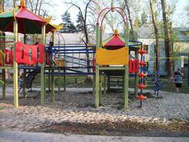 multi-colored slide on the playground day spring photo