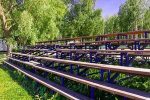 Wooden bleachers for fans the summer the sun photo