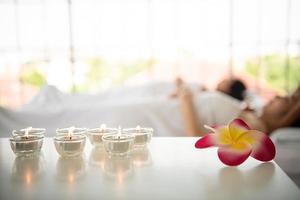 Portrait of young beautiful asian woman enjoys massage in a luxury spa resort photo
