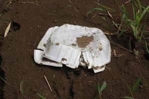 Styrofoam waste on the ground is white photo