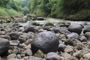 river rock on the edge photo