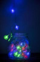 Festive jar full of decorative Christmas lights photo