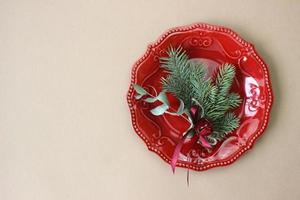 Christmas table decoration. Christmas dinner plate, cutlery decorated festive decorations. Winter holidays. Christmas card. Free space for your text. Merry Christmas, Happy New Year. photo