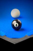 Match ball. Black eight ball in the pocket. photo