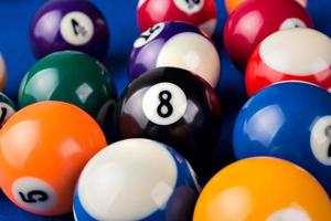 Different points of view billiard balls on a blue pool table. photo