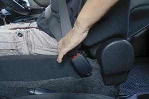 Woman driving, wearing seat belts. photo