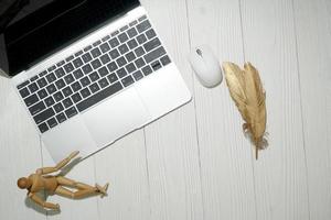 wood office desk table with laptop computer. Top view with copy space, flat lay. photo