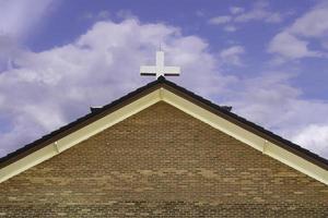 A small cross on church of Christ. photo