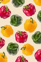 yellow red and green pepper on a wallpaper background. photo
