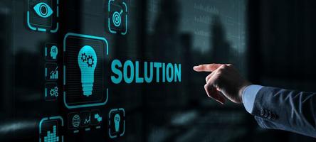 Solution. Businessman pressing on touch screen interface inscription Solutions. Business concept. Internet concept photo
