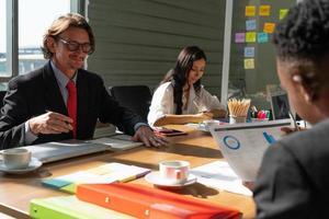 Middle Age Manager Working With Young Trainee in Office photo