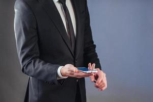 Businessman with a phone in his hand. photo