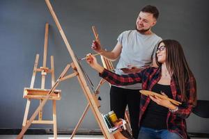 Creative artists have designed a colorful picture painted on canvas with oil paints in the studio photo