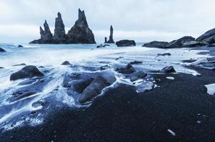 The Rock Troll Toes. Reynisdrangar cliffs. Black sand beach. Iceland. photo