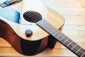 Photography classical guitar on a light brown background photo