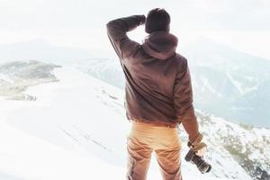 Tourist in winter mountains. Ukraine. Carpathians photo