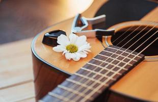 Photography classical guitar on a light brown background photo