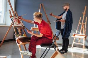 Creative artists have designed a colorful picture painted on canvas with oil paints in the studio photo