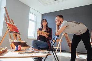 Group of students painting at art lessons photo