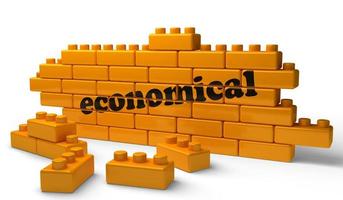 palabra económica en la pared de ladrillo amarillo foto