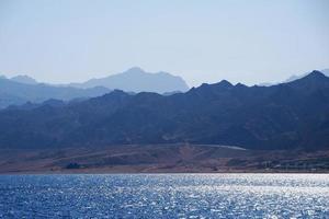 high mountains in the desert at the beach photo