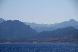 high mountains in the desert in egypt and sea photo