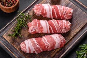 A delicious dish of pork mince wrapped with delicious pieces of bacon photo