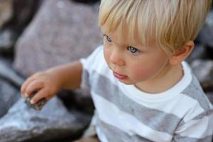 Cute boy with blond hair and blue eyes photo