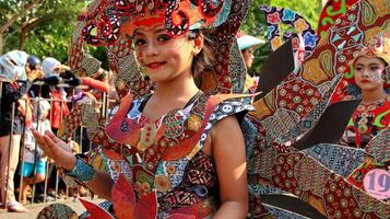 Participants in a modified batik costume while in action at the 113th anniversary of the Pekalongan city parade photo