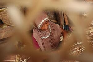 bamboo basket craftswoman while doing his work in a place, Batang, Jawa Tengah, Indonesia, May 26, 2019 photo