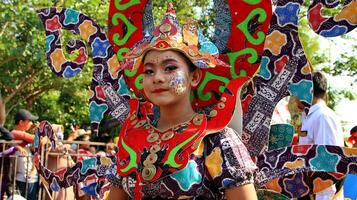 Beautiful women participate by wearing unique costumes at the Pekalongan batik carnival, Pekalongan, Indonesia photo